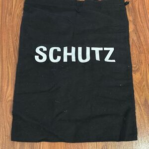 Schultz black and white shoe bag dust